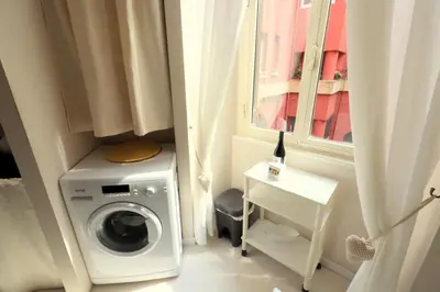 a washing machine in a room with a window at Pamphili Park Romantic Retreat in Rome