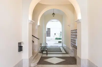 a hallway of a house with an archway at Cesar Vatican Rooms in Rome