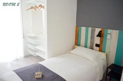 a small bedroom with a bed and a closet at Gianicolo Country Room in Rome