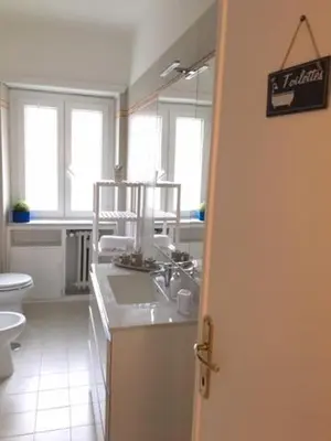 a bathroom with a sink and a toilet at RELAX INN VATICAN in Rome