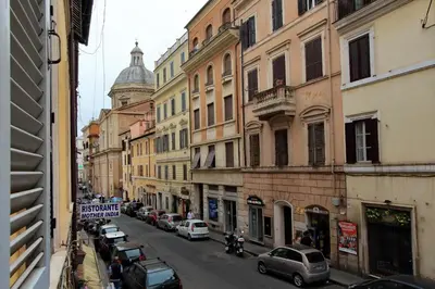 a view of a city street with cars and buildings at Monti Charm by the Colosseum in Rome
