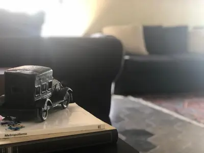 a toy car sitting on top of a book at Monti Charm by the Colosseum in Rome