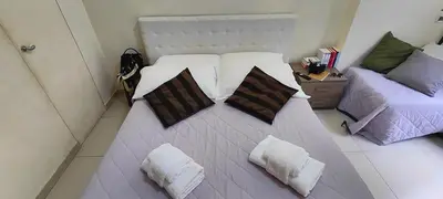 a hotel room with two beds and a window at Visconti apartment. in Rome