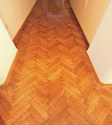an empty room with a wooden floor in a house at Roma center Fori Imperiali Raffy's charming Suite in Rome