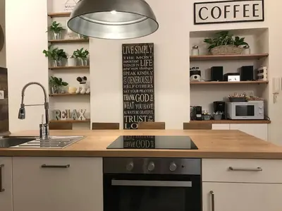 a kitchen with a counter top with a coffee sign at THE BREAK - Via Veneto Charming Suite in Rome