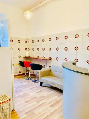 a living room with a couch and a table at COMFORT INN ROMA TERMINI in Rome