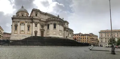 an old building in the middle of two buildings at Colosseo Room in Rome