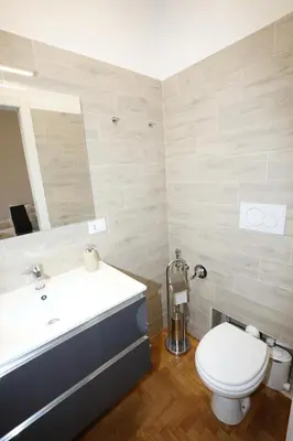 a bathroom with a toilet and a sink at Unique luxury apartment and rooms in Rome