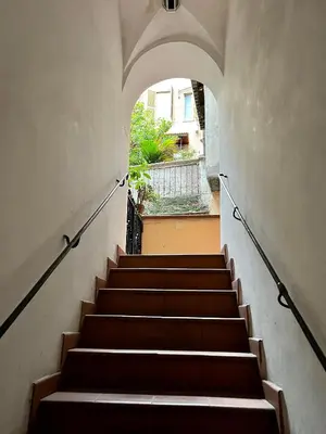 a staircase leading up to a building with an archway at Charming Campo de' Fiori in Rome