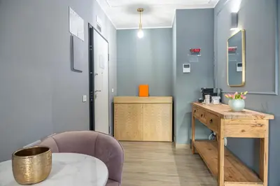 a room with a desk and a chair and a table at Nouvelle Maison Rome Luxury Palace in Rome