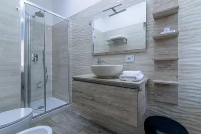 a bathroom with a sink and a shower at Zeus Inn - Una finestra sul Vaticano in Rome