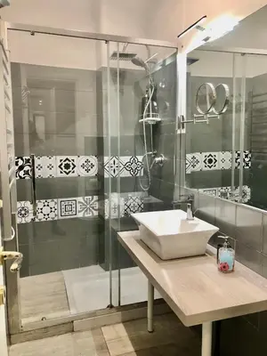 a bathroom with a sink and a shower at CRIS - close to VATICAN - Centre&StadiumArea in Rome