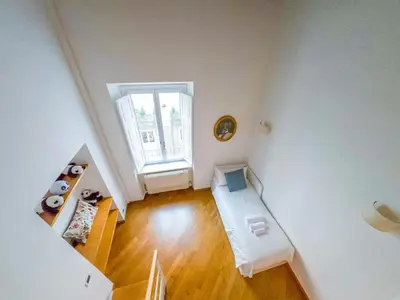 a bedroom with a bed and a stuffed panda bear at Pandy Suite in Rome