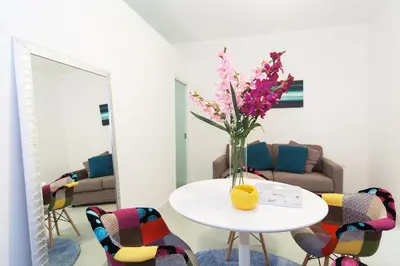 a room with a table with a vase of flowers on it at Casa Bella Pantheon in Rome