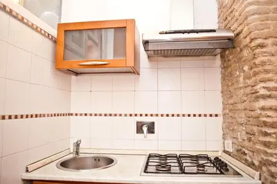a kitchen with a sink and a counter top at The heart of Trastevere in Rome