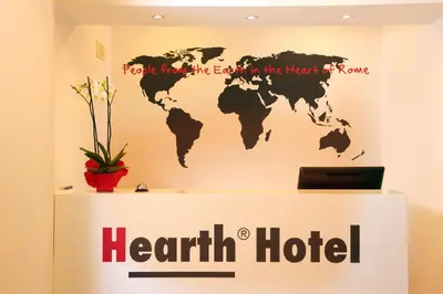 a sign for a heart hotel with a world map on a wall at Hearth Hotel in Rome