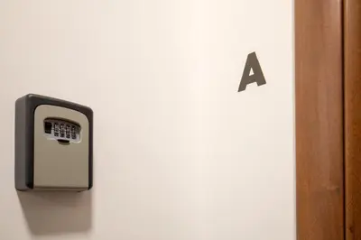 a pay phone on a wall next to a door at Fornaci Vatican Flat in Rome