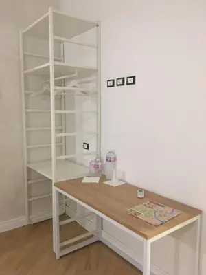 a desk in a room with a book shelf at Affreschi a San Pietro in Rome