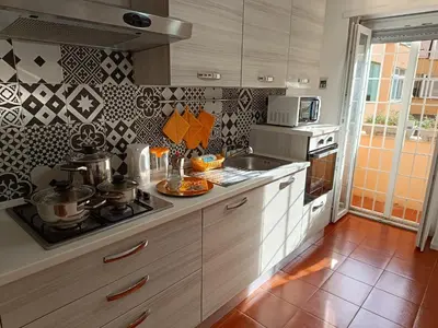 a kitchen with a sink and a stove top oven at Casa Vacanze Mafalda - Roma Stazione Trastevere in Rome
