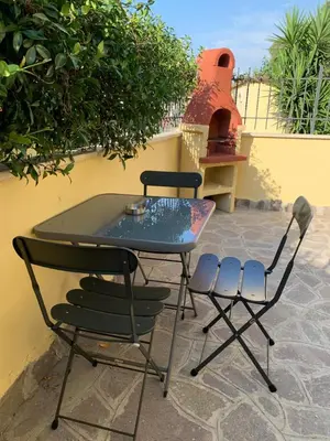 a table and chairs sitting on a patio at A casa di Elly in Rome