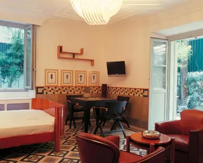 a living room with a table and chairs at Villa Laetitia in Rome