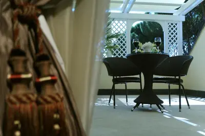 a black table and chairs in a room at Hotel Villa Duse in Rome