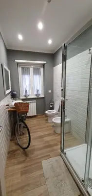 a bathroom with a shower and a bike in it at Da Nonna Maria in Rome