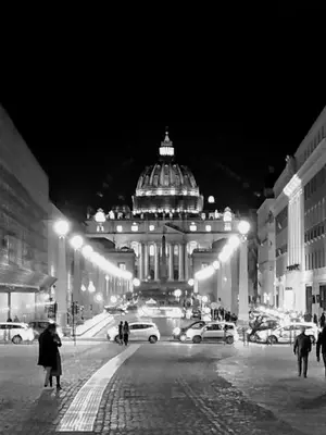 a black and white photo of a building at night at Art Atelier Vaticano Guest House in Rome