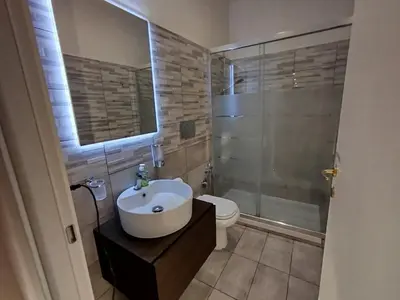 a bathroom with a sink and a toilet and a shower at Almachiara in Rome