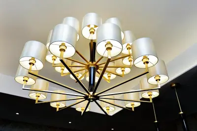 a large white chandelier hanging from a ceiling at Spanish Diamond Luxury Suites & Jacuzzi in Rome