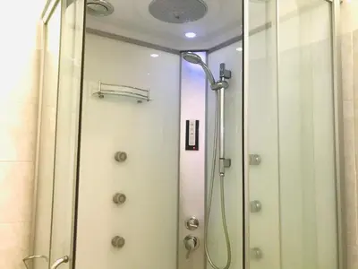 a shower in a bathroom with a glass door at welcome Termini in Rome
