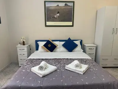 a bedroom with a bed with towels on it at welcome Termini in Rome