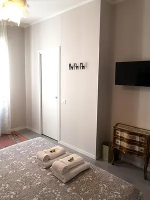 a room with three pillows on the floor in front of a door at Interno Otto in Rome