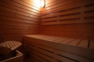a wooden sauna with a bed in it at SuiteFrattini Private Spa in Rome
