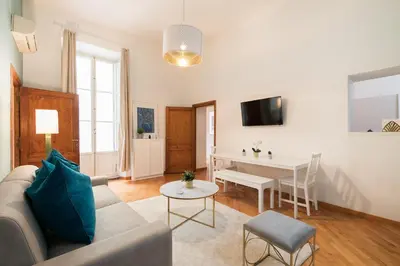 a living room with a couch and a table at VENETO AVENUE in Rome