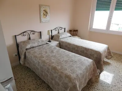 a bedroom with two beds and a window at My House in Rome in Rome