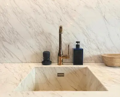 a sink with a faucet in a bathroom at Boutique Loft steps from the Colosseum - Gio Roma in Rome