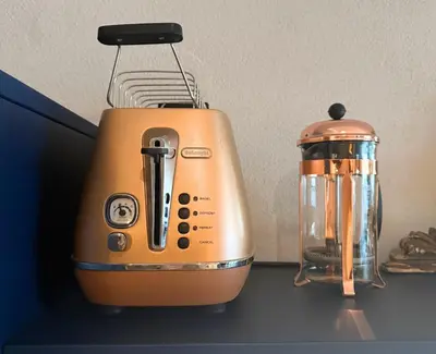 an orange toaster and a blender sitting on a counter at Boutique Loft steps from the Colosseum - Gio Roma in Rome
