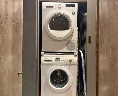 a washing machine and a dryer in a room at Boutique Loft steps from the Colosseum - Gio Roma in Rome