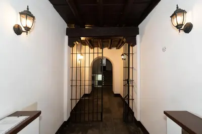 a hallway in a building with two lights on the wall at POPOLO PEN 56 Apartament in Rome