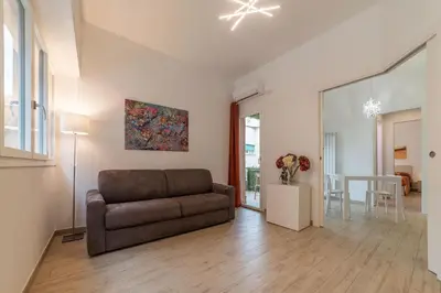 a living room with a couch and a table at Appartamenti Clivo di Monte del Gallo in Rome