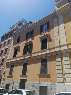 a building with many windows on the side of it at Magna Domus in Rome