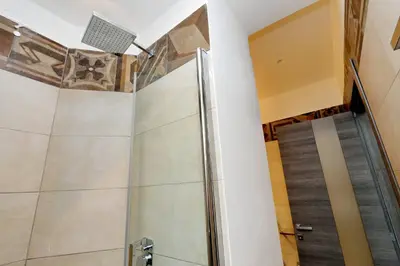 a shower in a bathroom with a ceiling at Houses&HousesVEDOROMA in Rome