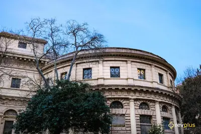 a large stone building with a tree in front of it at Cozy flat in Rome in Rome