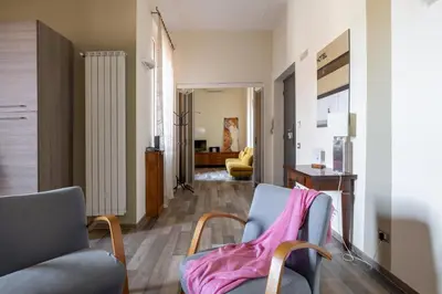 a living room with two chairs and a couch at HospitalityRome Domus Aureliana in Rome
