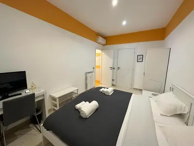 a bedroom with a bed with two white pillows on it at B&B Una notte a Mazzini in Rome