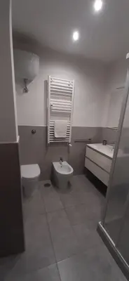a bathroom with a toilet and a sink and a tub at MCM in Rome