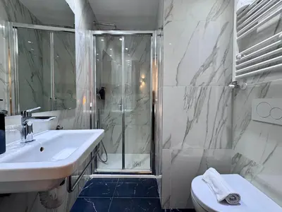 a bathroom with a shower and a sink and a toilet at Room Roma Nazionale in Rome