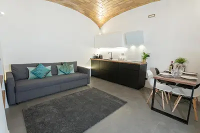 a living room with a couch and a table at Testaccio historic house in Rome