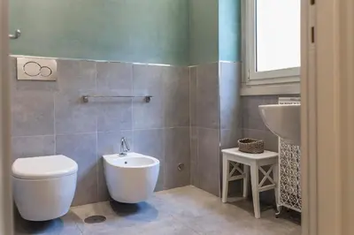 a bathroom with a toilet and a sink at Dulcis In Vatican b&b in Rome